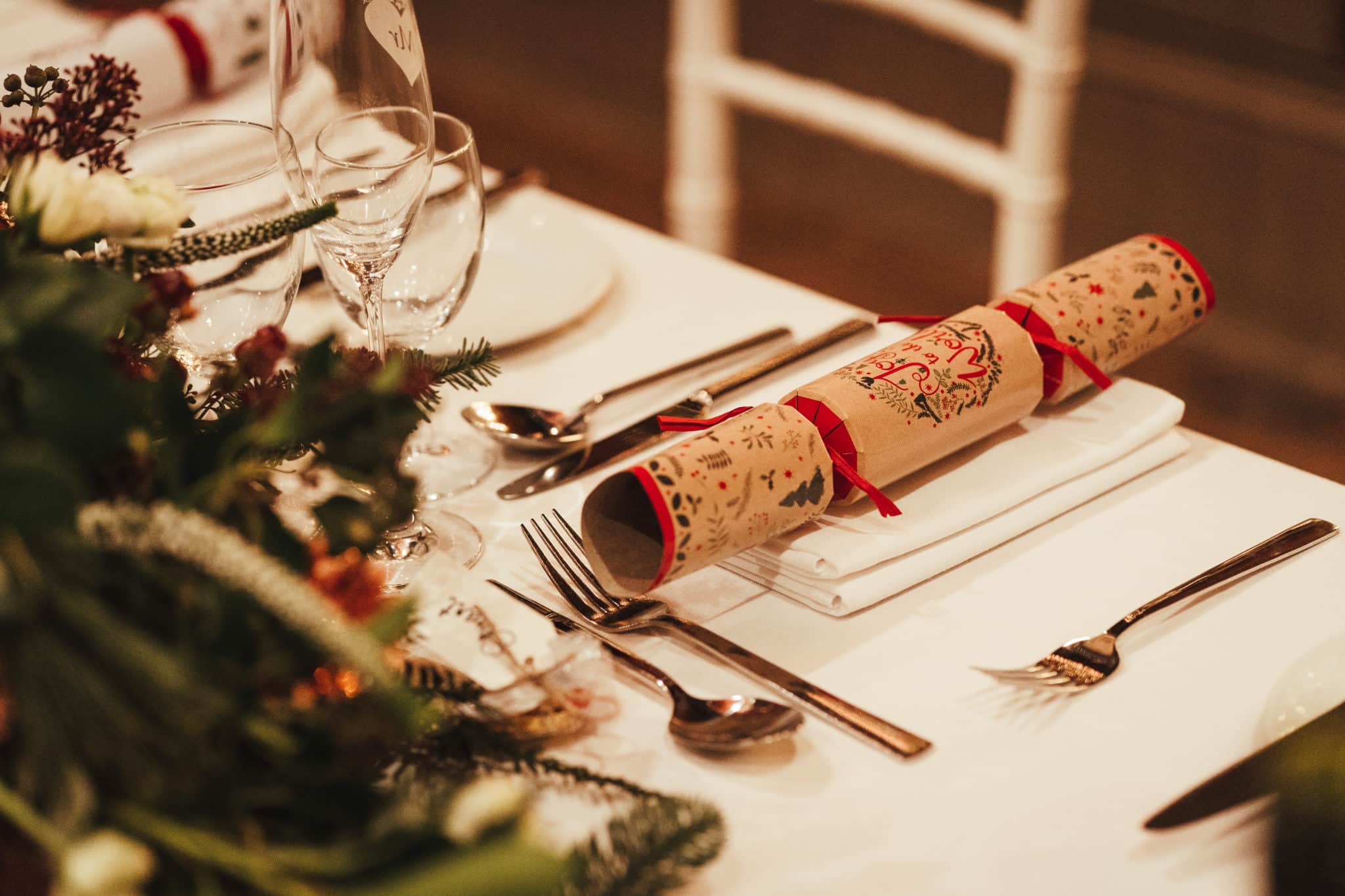 Table set with cutlery and a Christmas cracker