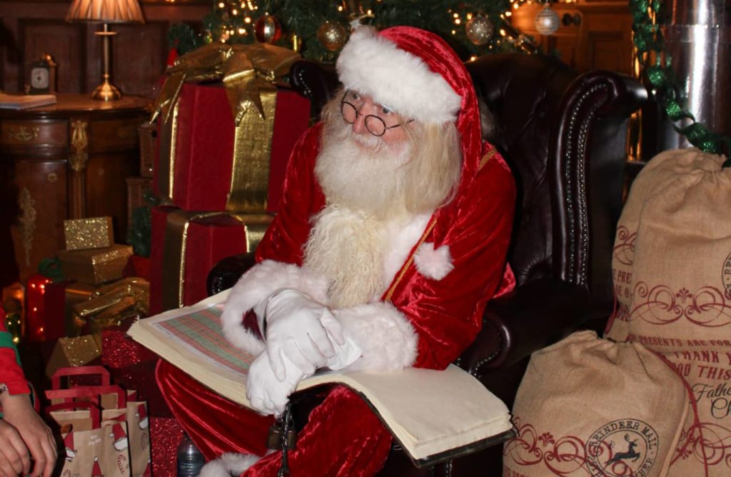 Santa Clause Sitting with a book