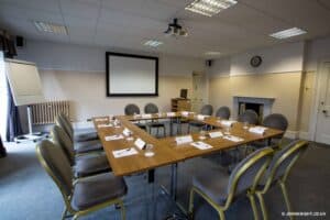 Room prepared for a business meeting with a white board