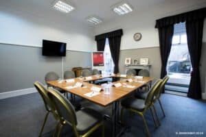 Room prepared for a business meeting with a white board