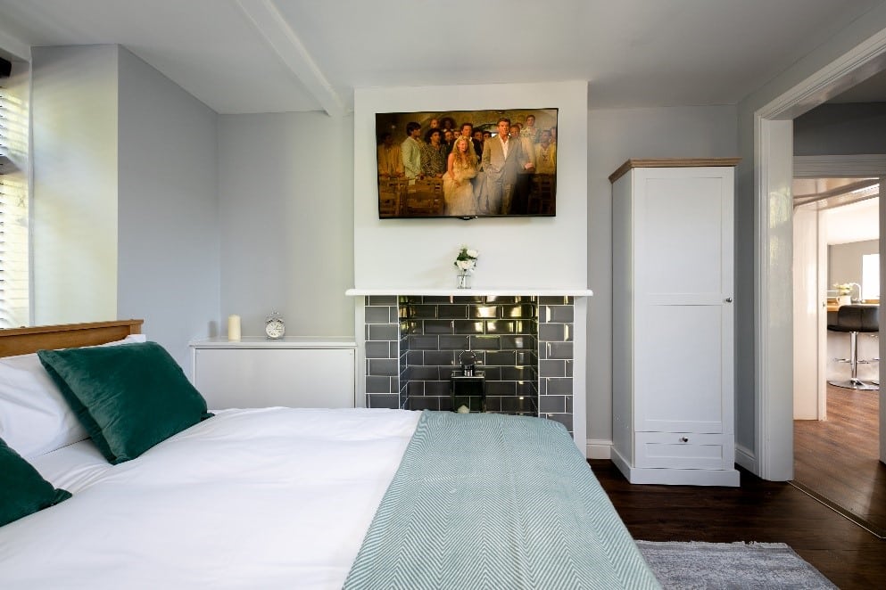 Bedroom with a chimney at One Warwick Park