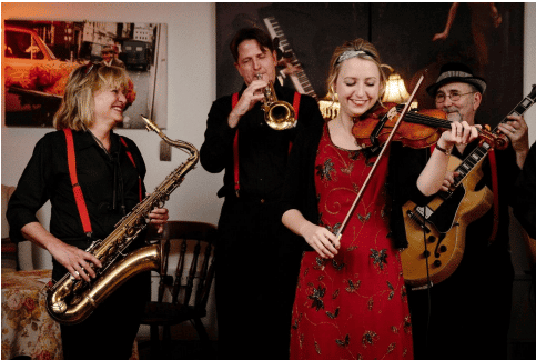 A band of four musicians playing music