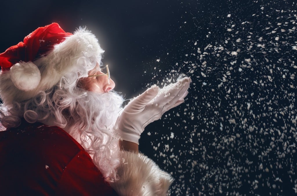 Santa Claus blowing snow