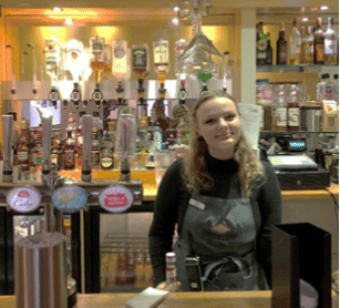 Bartender behind the bar