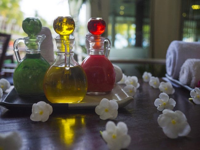 Three glassware pieces with different colour liquids