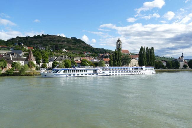 Long boat docked on a river