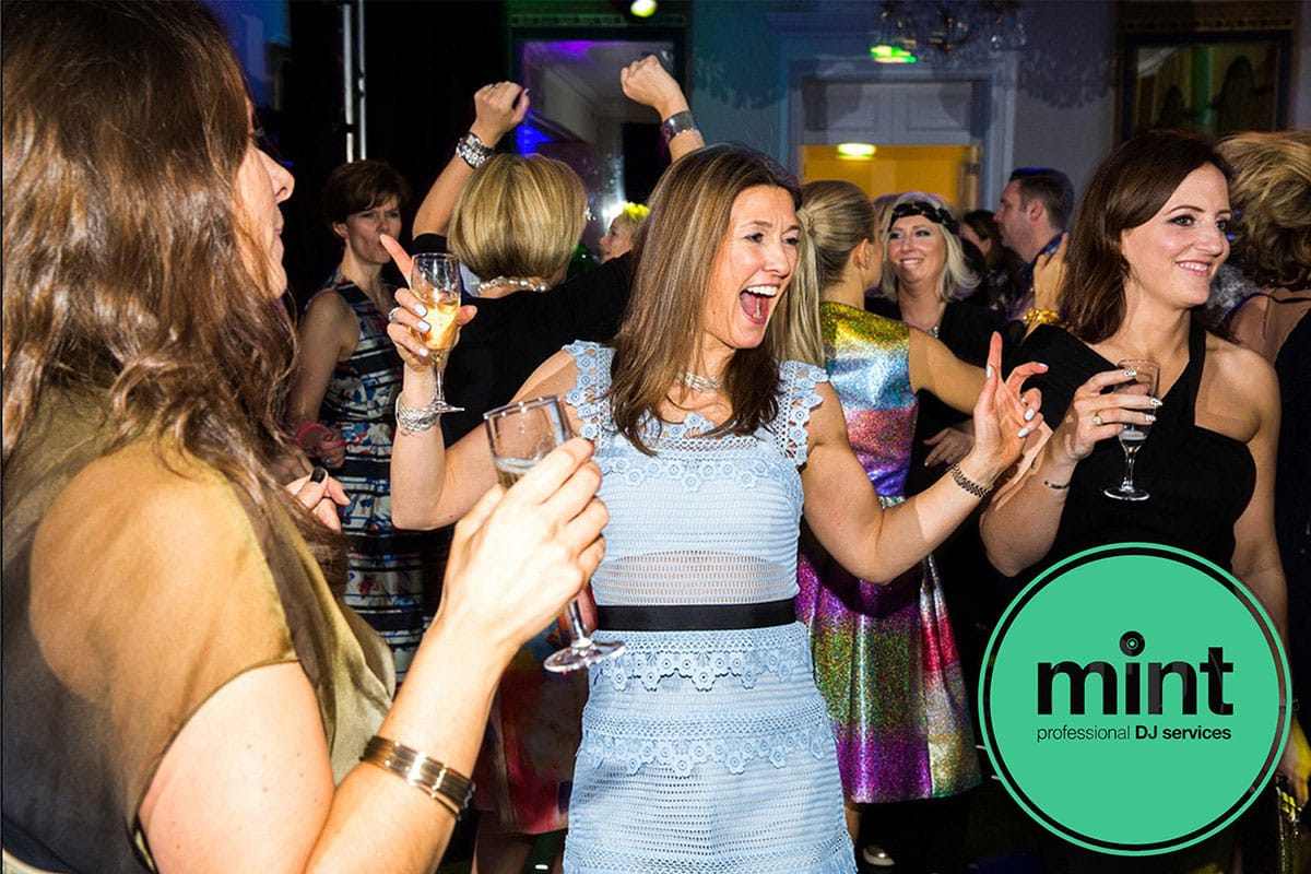 Women dancing and smiling during a mint djs event