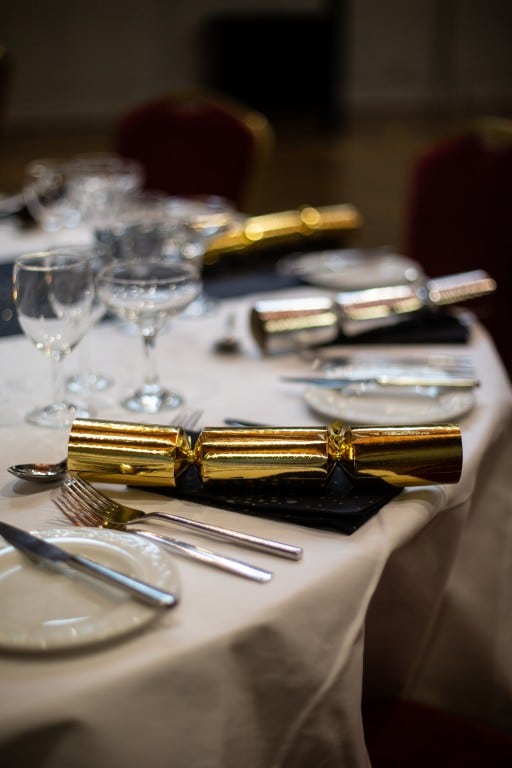 Christmas Crackers on a laid table.