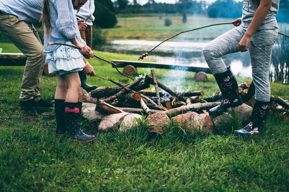 People cooking on a campfire