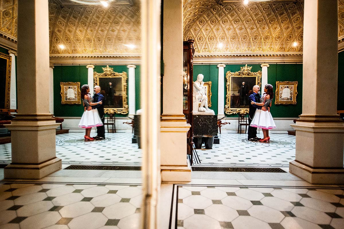 Mirrors reflecting newly wed couple dancing