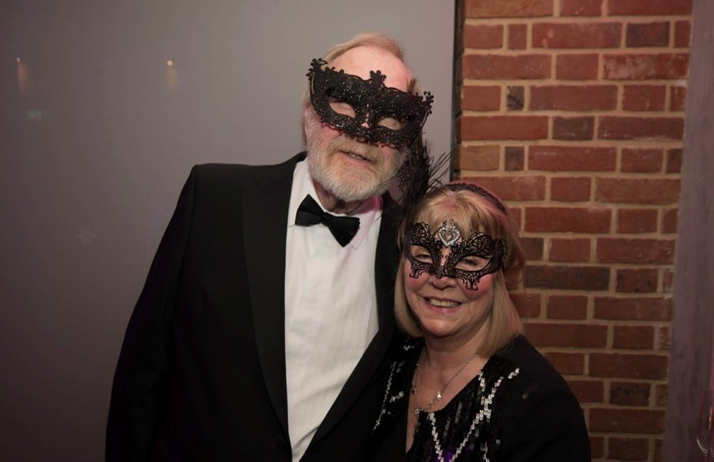 A couple in masquerade costumes 