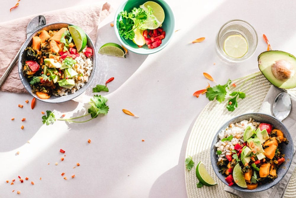 two bowls of healthy vegetable dishes