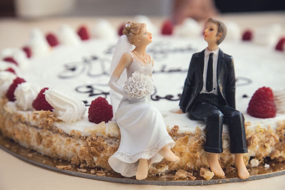 Wedding cake with figurines of a bride and a groom