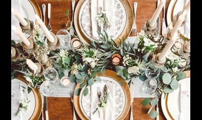 Table set with fancy cutlery and flowers