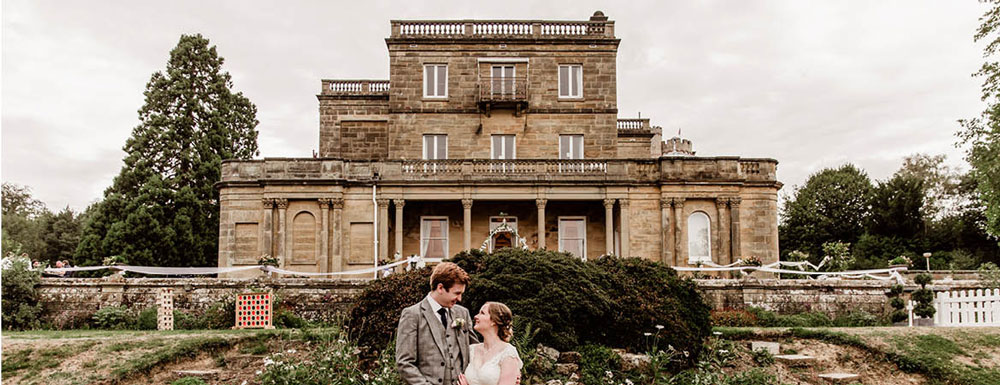Married Couple Looking at each other outside salomons Estate