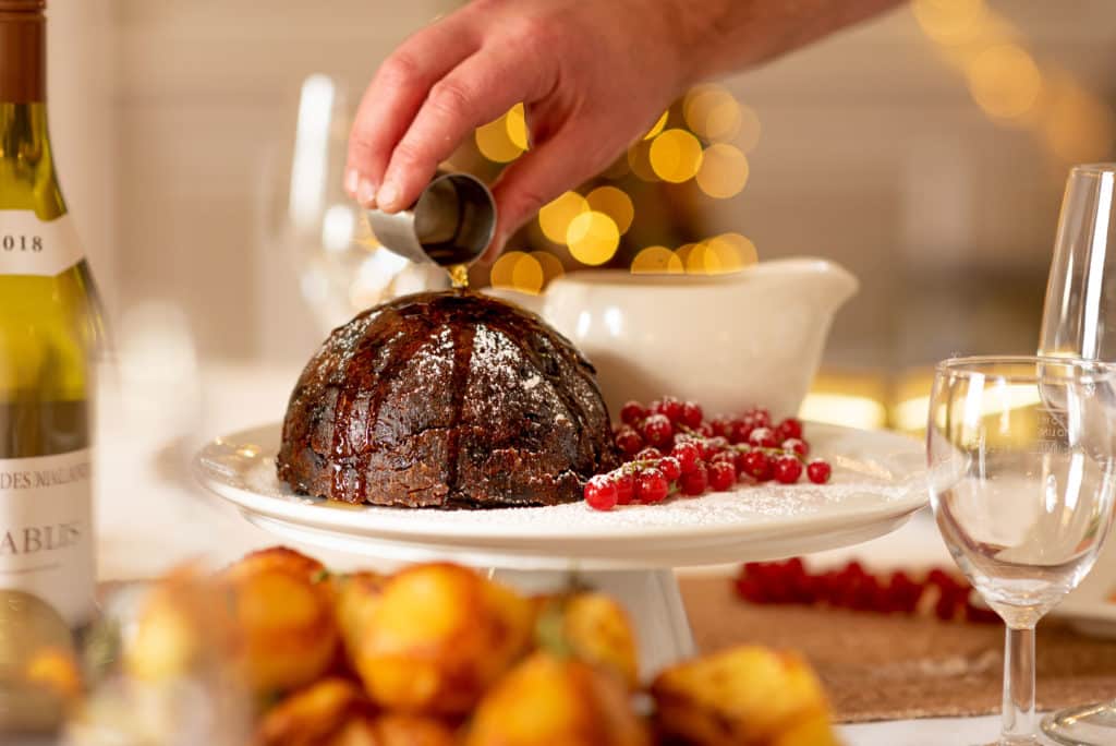 Brandy being poured on Christmas pudding