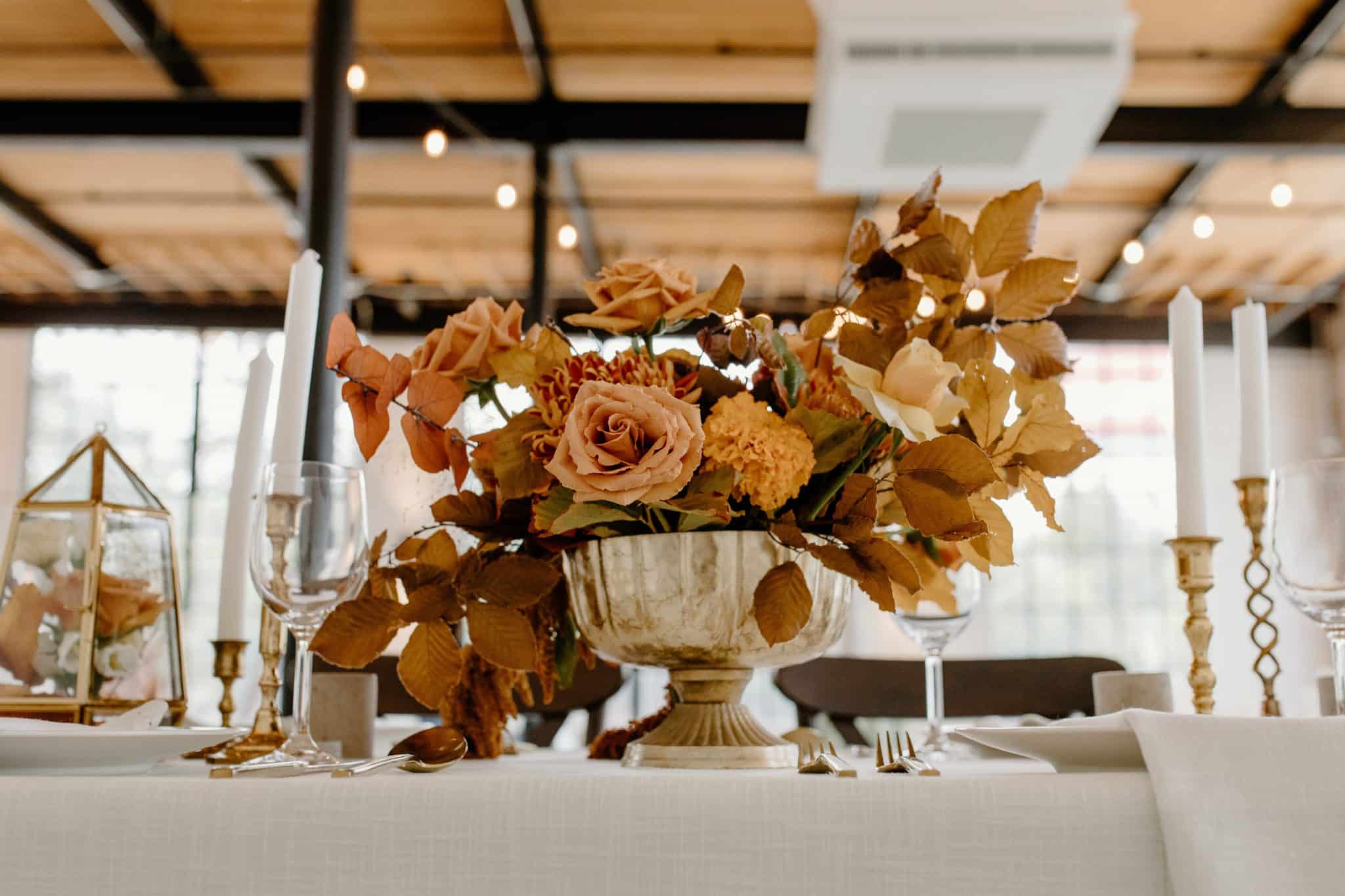 bowl of flowers with an earthy, autumnal colour