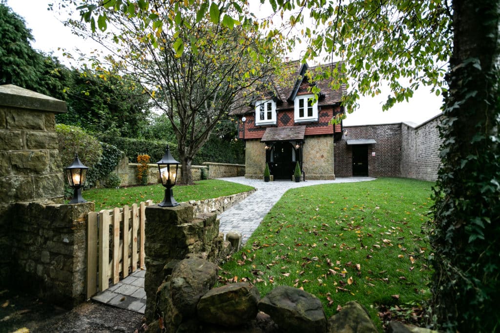 Two storey House with a yard that has a stone path to the door