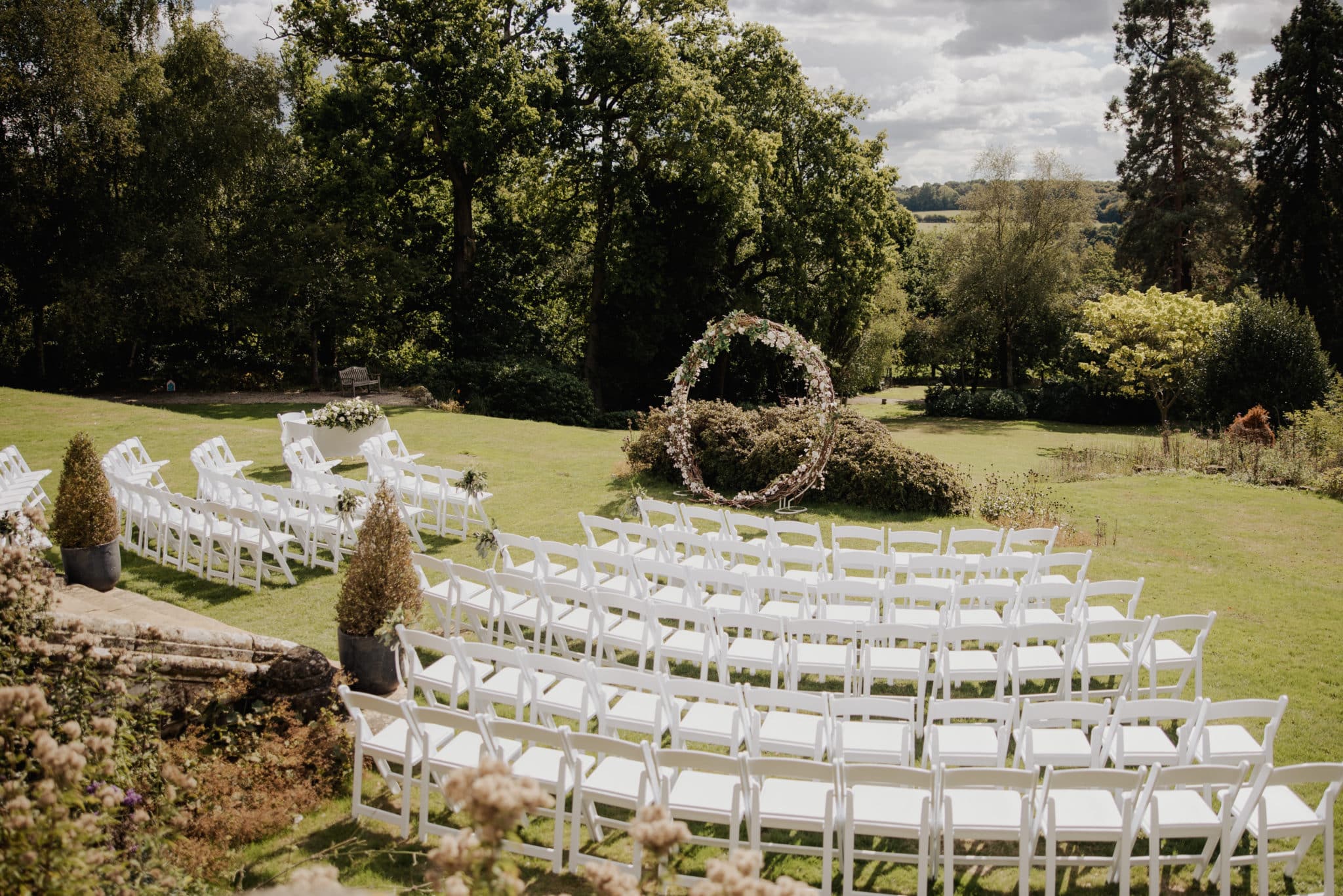 outside seated area ready for a ceremony in the gardens at Salomons Estate