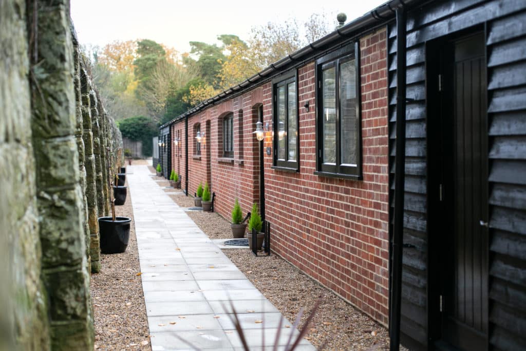 stone path that goes past the entrances of salomons estates garden cottages