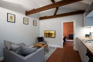 Inside of a house with a living room and kitchen