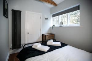 Bedroom with toiletries on the bed