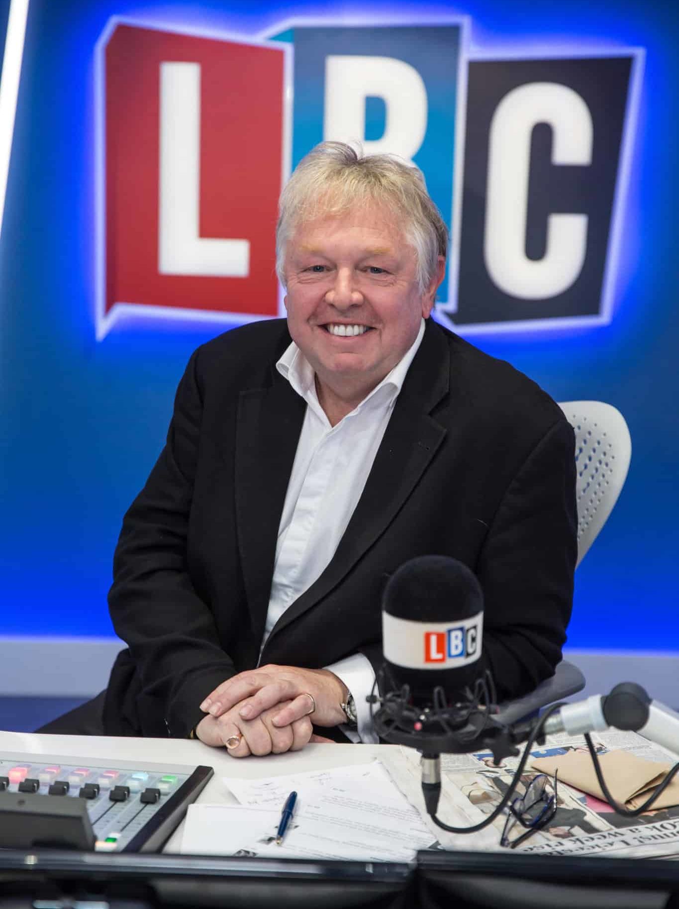 Nick Ferrari Infront of the lbc logo