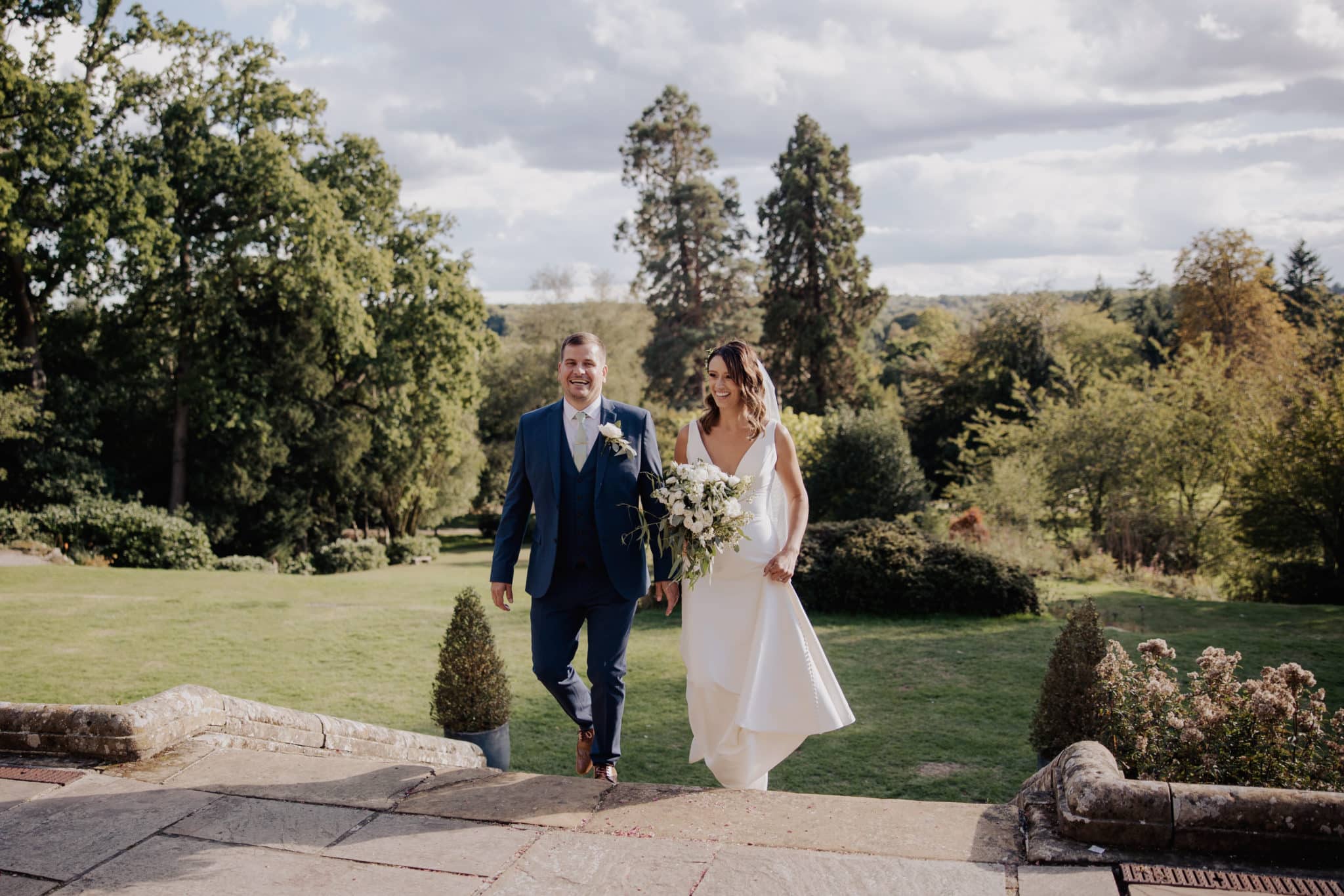 Bride Walking up stairs with a man