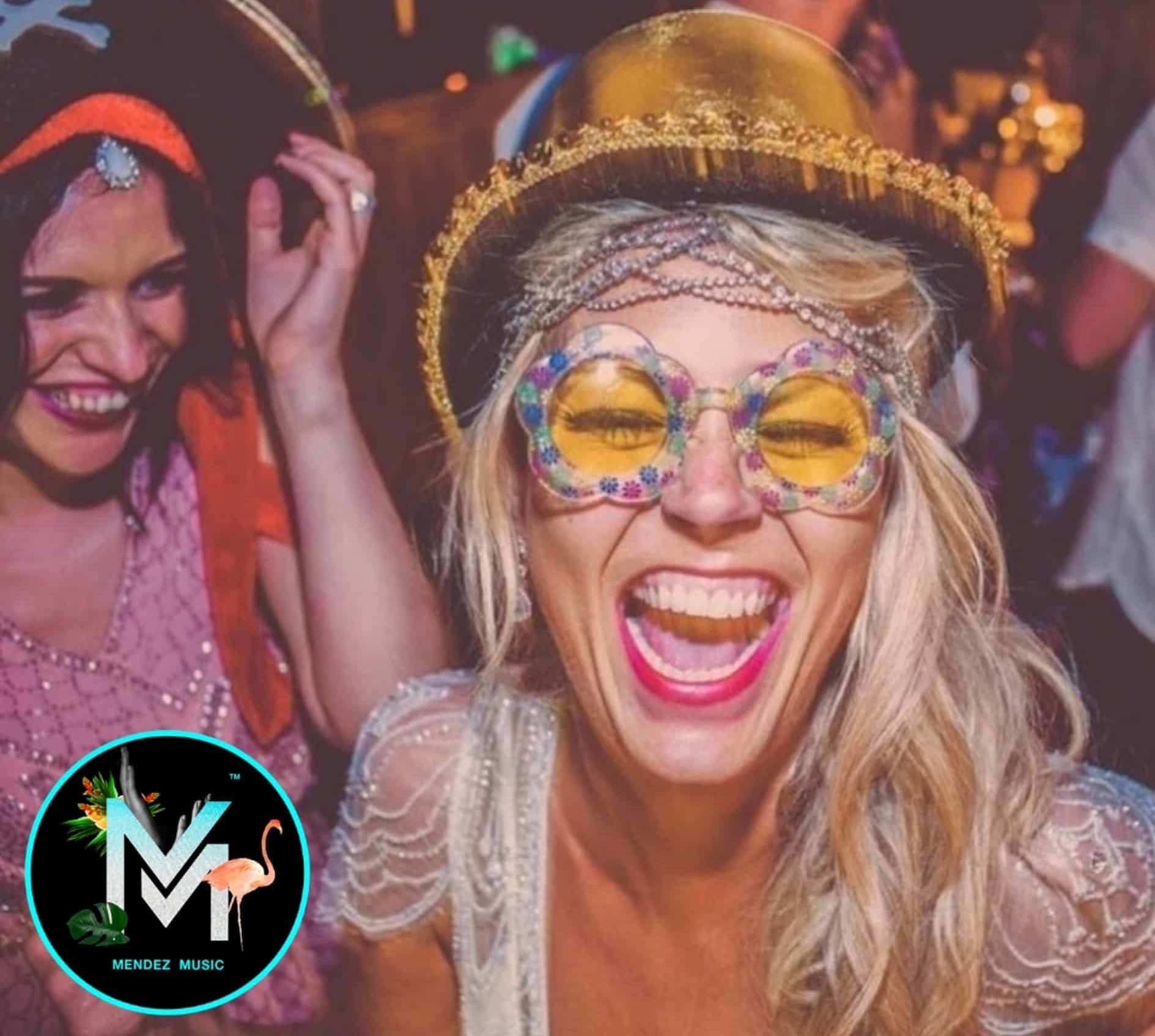 Two People Laughing With Colourful Clothes with a Mendez Music logo at the bottom corner