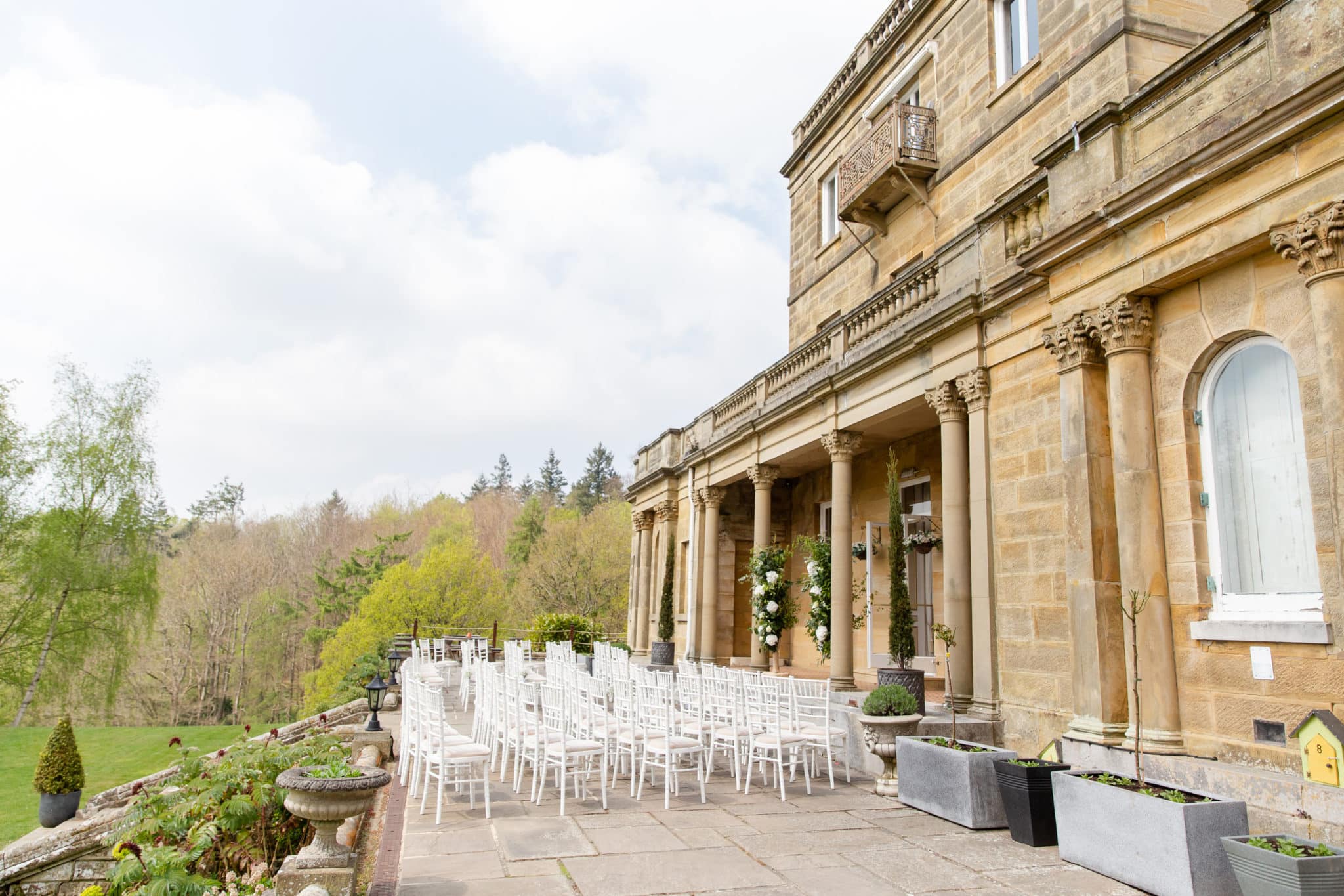 Outdoor area of salomons estate with white chairs