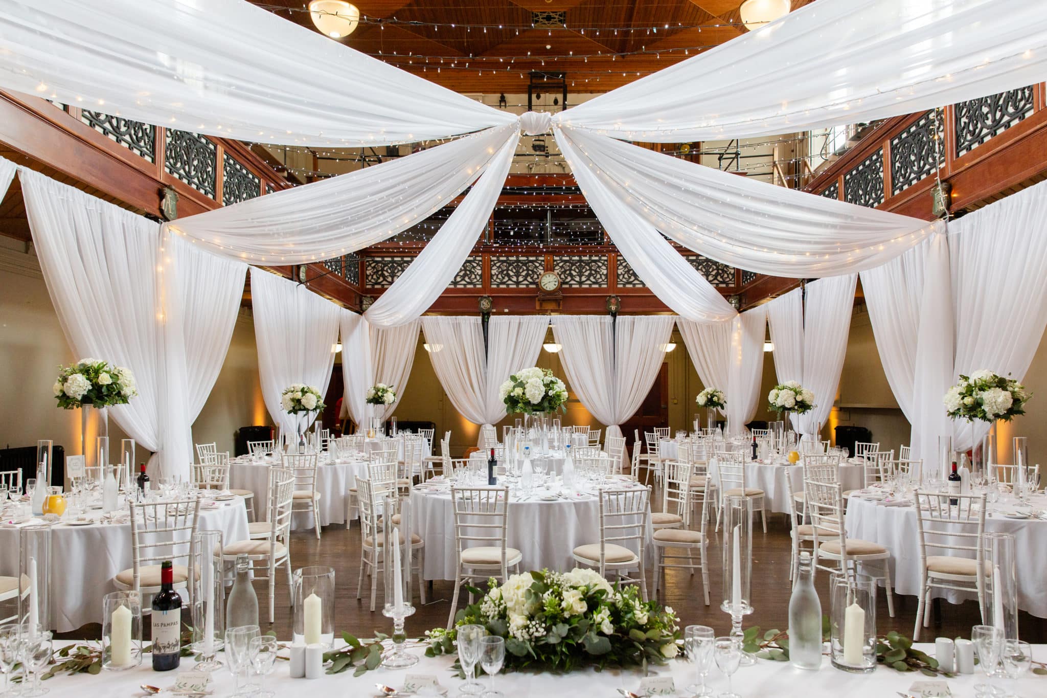 Wedding reception area with white decorations