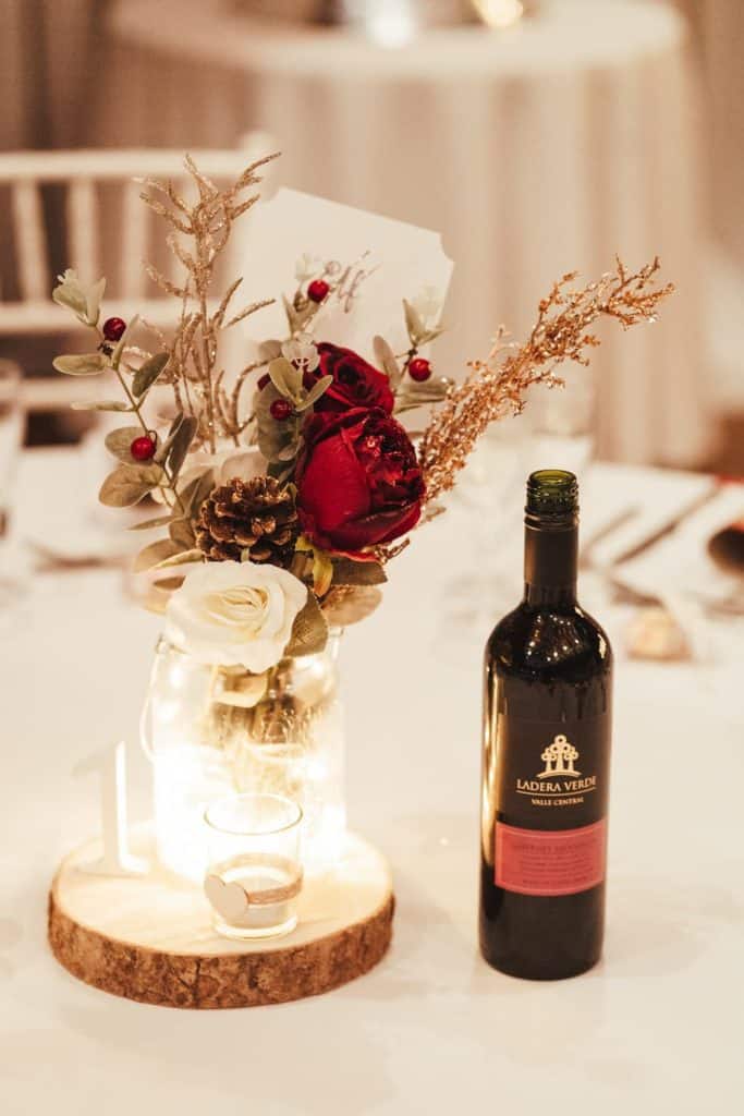 Flower arrangement and bottle of wine