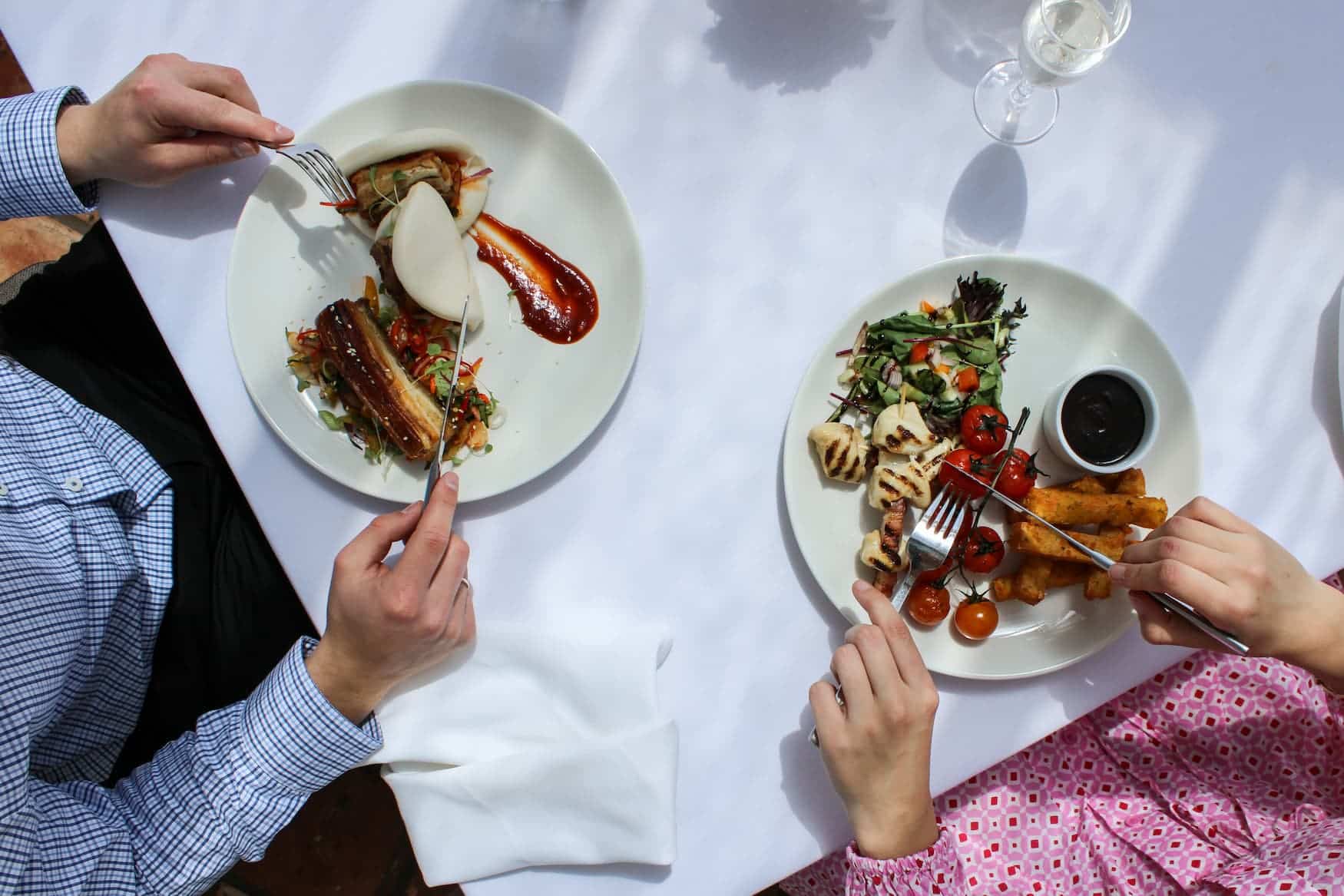 Two people eating a meal