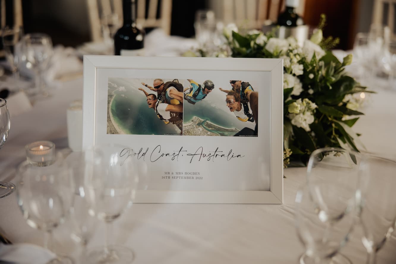 Images of couple skydiving on wedding table