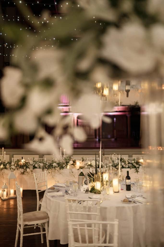 Tables set for a wedding with candles and flowers