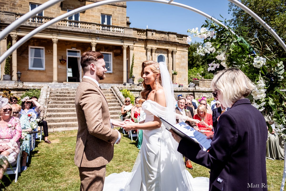 wedding reception with bridge and groom standing in front of salomons estate house