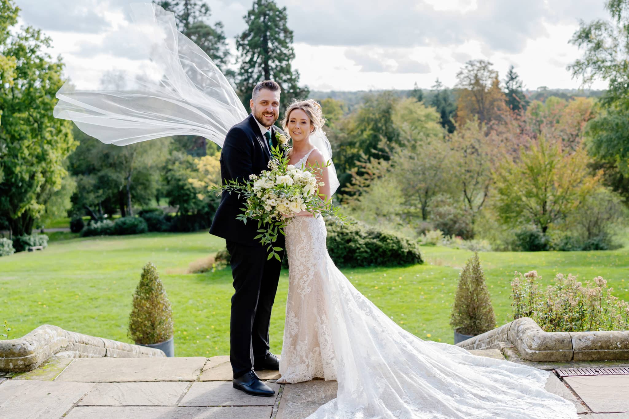 married couple standing in the grounds of salomons estate