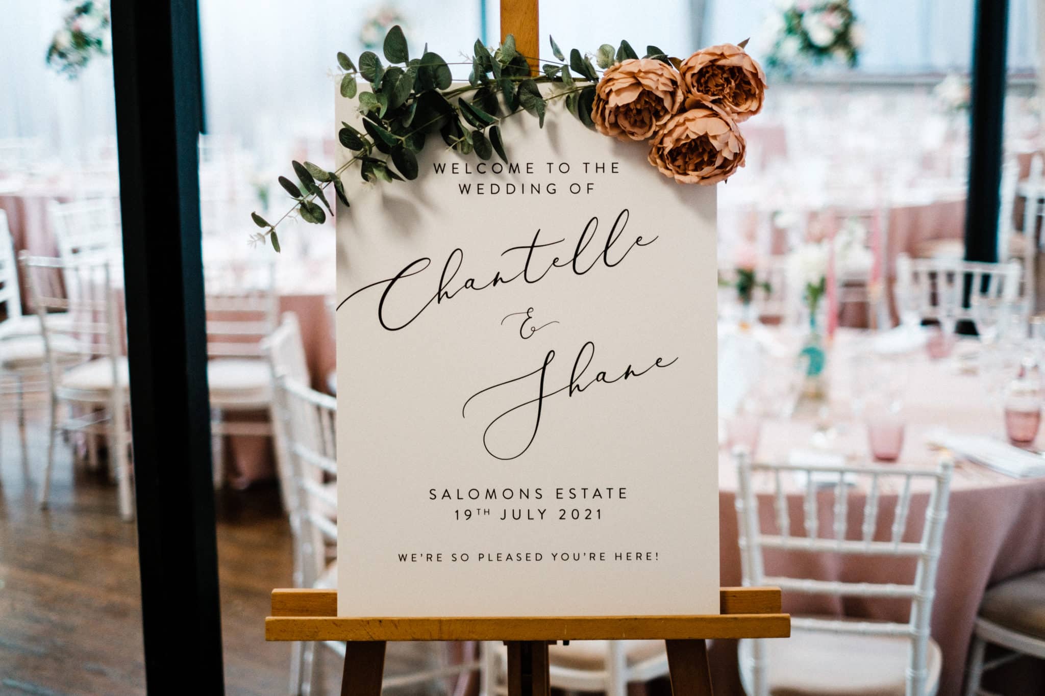 wooden easel holding a welcome message