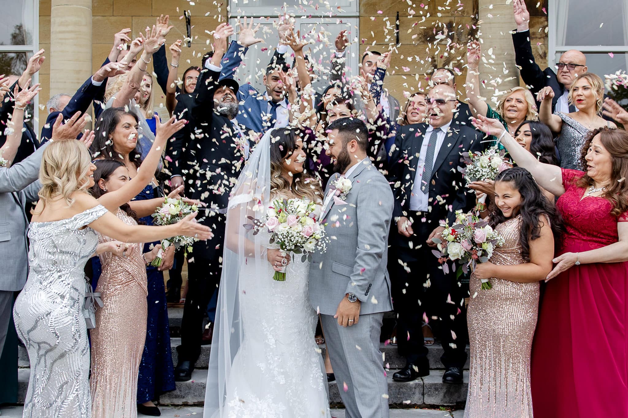 married couple in a confetti shower