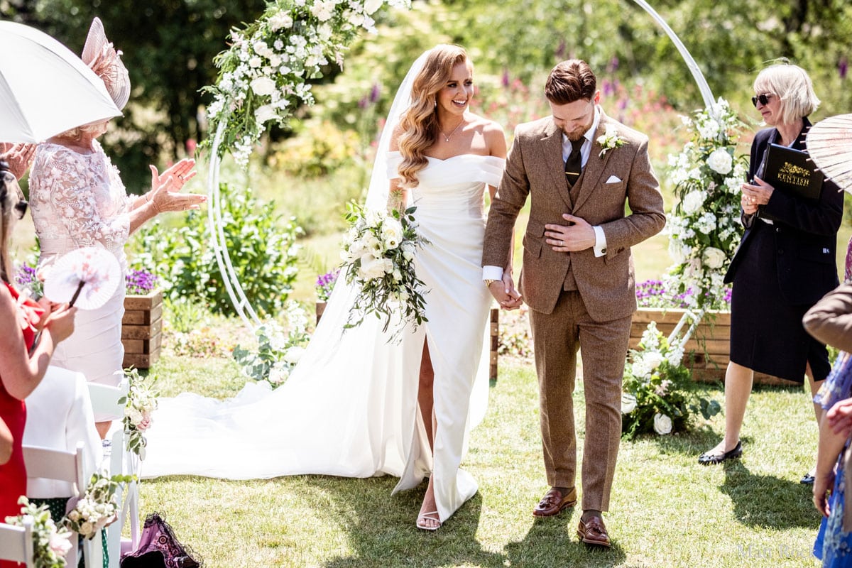 Wedded Couple walking holding hand